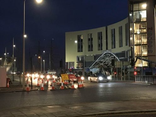 Rush hour traffic at the partially closed road at the waterfront.