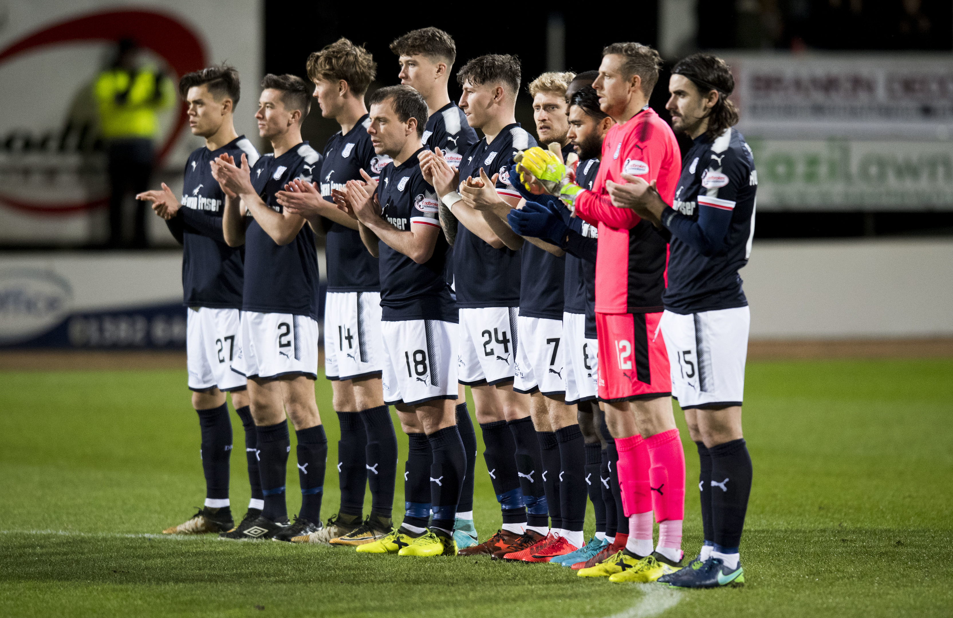 The Dundee players observed a minute's applause before the match.