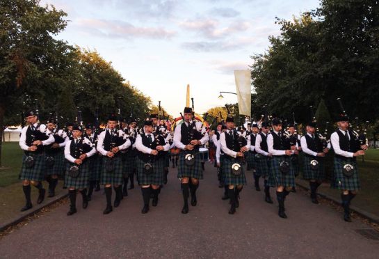 The Mackenzie Caledonian pipe band at the World Championships in June last year.