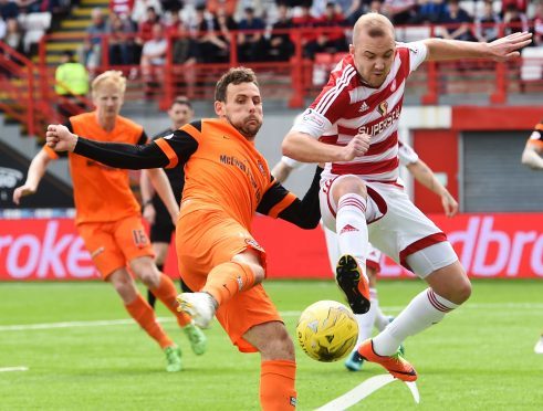 Grant Gillespie in action against United.