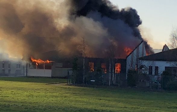 The blaze took hold quickly and destroyed a large part of the infant building.