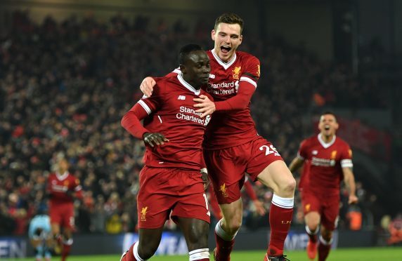 Liverpool scorer Sadio Mane is congratulated by Andy Robertson.