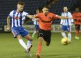 Craig Slater in action against United.