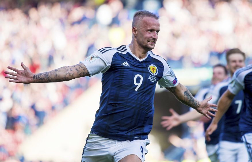 Leigh Griffiths celebrates his second goal against England in 2017. 