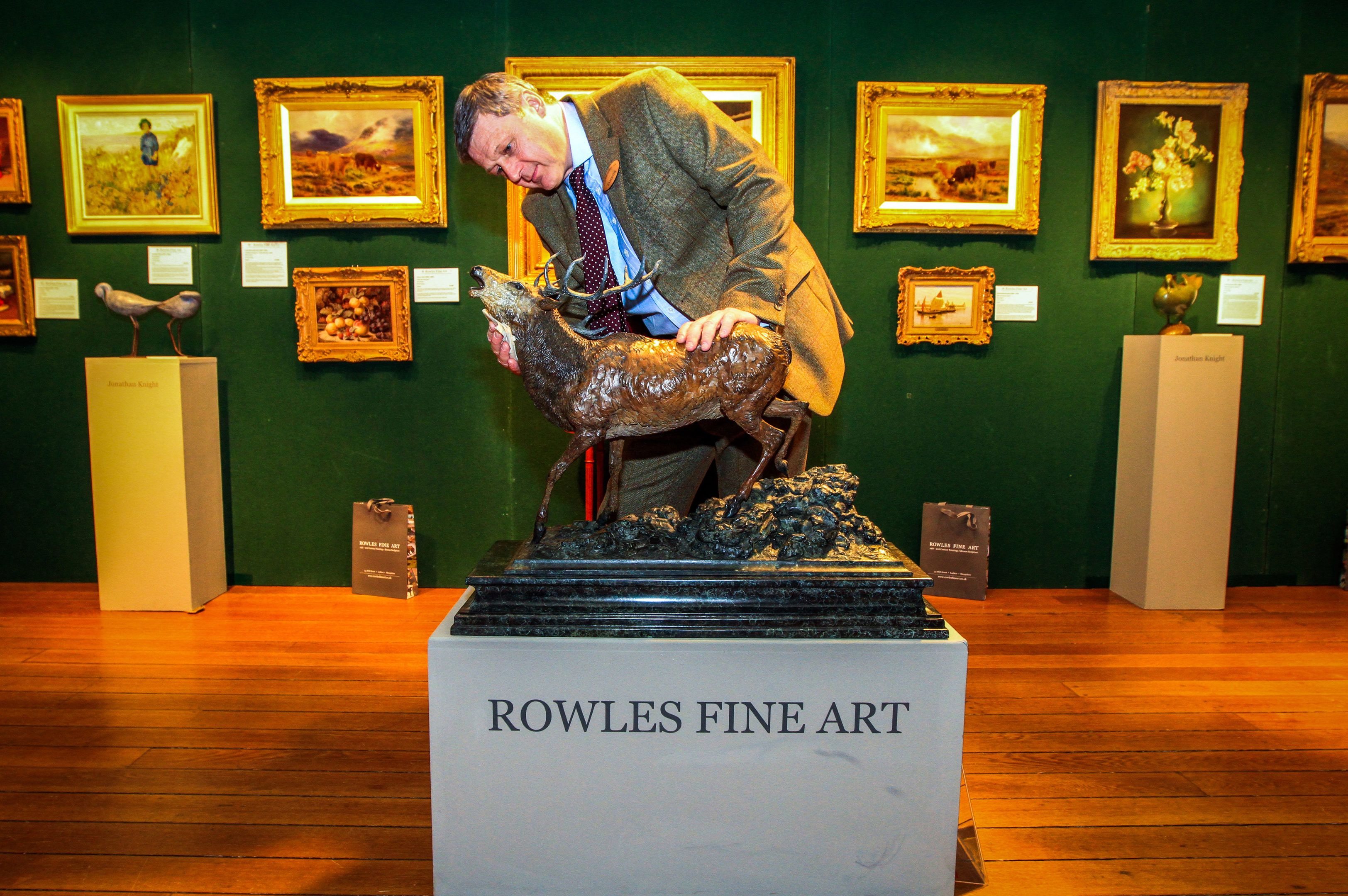 Glenn Rowles of Rowles Fine Art with a Stag bronze sculpture at a previous Galloway Antiques Fair.