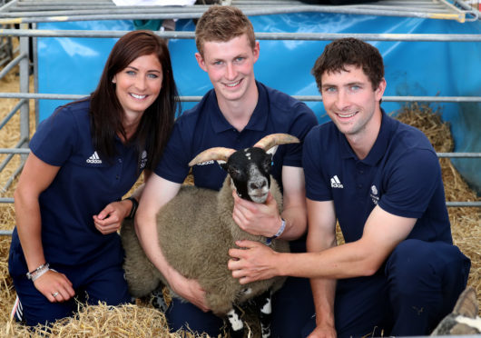 Eve with her brothers Thomas (centre) and Glenn.