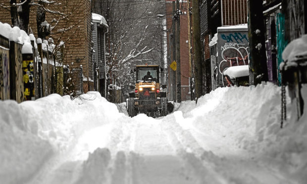 Life goes on in Montreal, Canda, after a harsh winter blast.