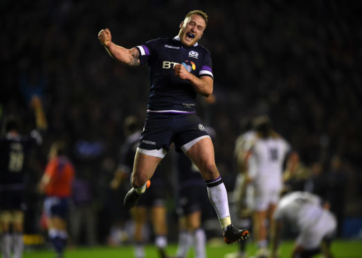 Stuart Hogg celebrates at the end of Scotland's Calcutta Cup victory.