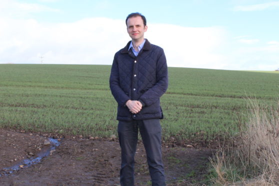 Stephen Gethins MP on the site of the proposed Cupar North development.