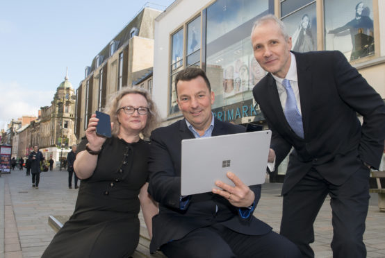 Event organiser Simon Baldwin (centre) with Leigh Brown of Association of Town & City Management Scotland and Stuart Black, director of Highland Council development & infrastructure.