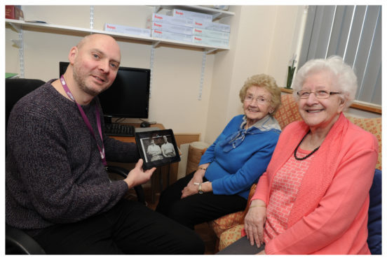 Dan Brown videographer,chats to some of the ladies who attend the Age Concern in Glenrothes,  Cathy Steward  and Isa Murray.