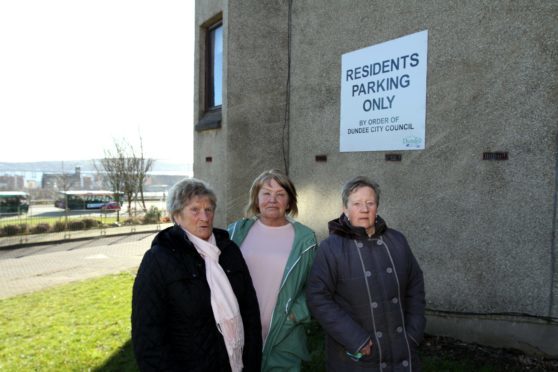 Mary MaAullay, Sandra Small and Pearl Christie by the sign.