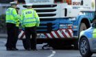 The bike can be seen underneath the lorry after Wednesday afternoons accident.
