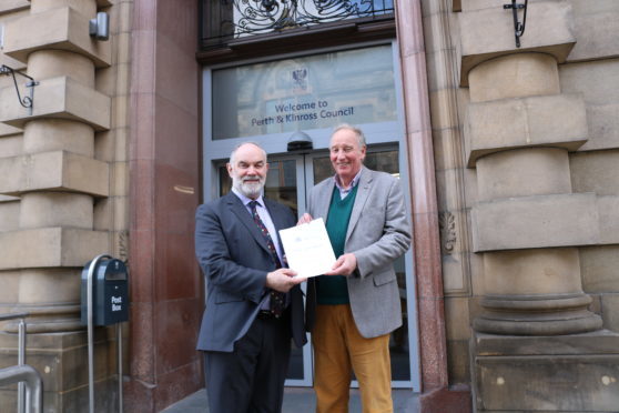 Councillor Murray Lyle (left) with chairman of Perth Civic Trust, David MacLehose,, receiving a submission from the trust.
