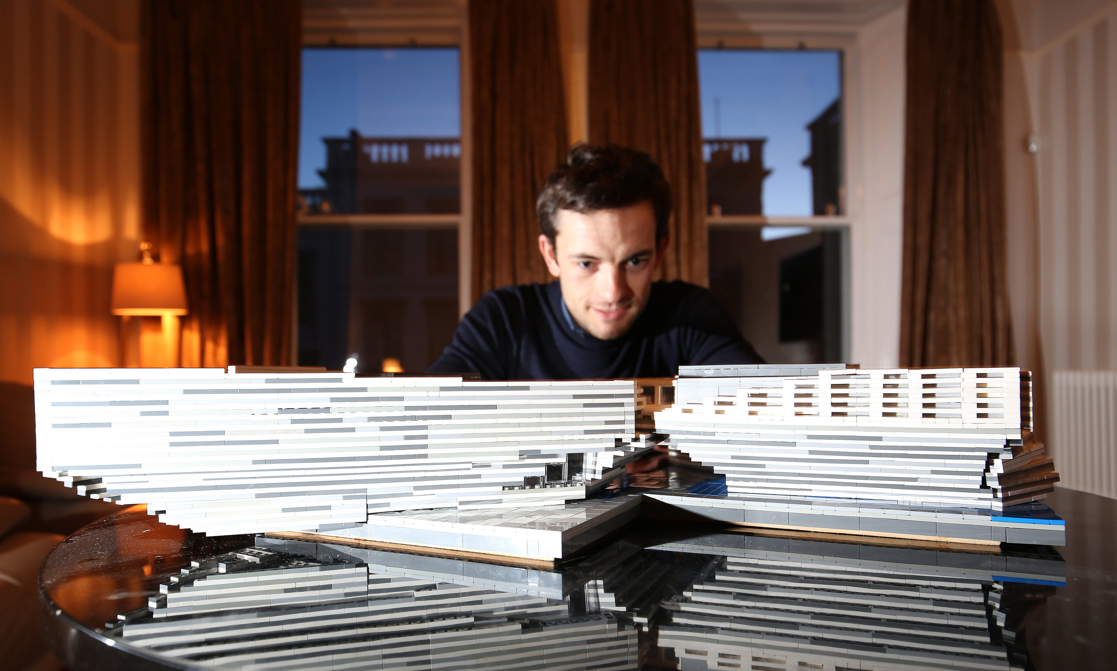 Brian McNicoll with his model of V&A Dundee.