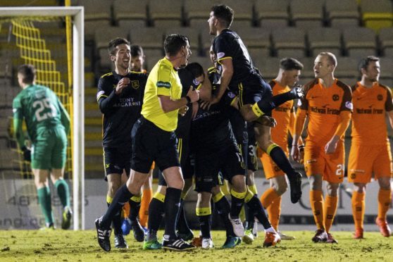 The Livi players celebrate their opening goal.