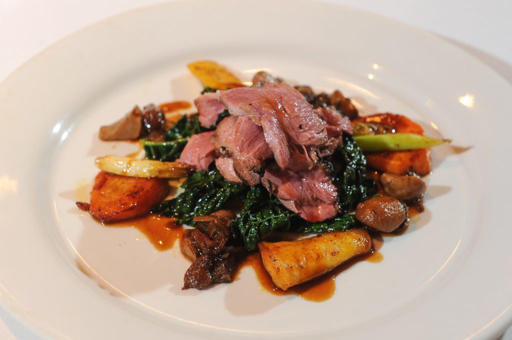 Main course - Roast Breat of Duck with Cavolo Nero Kale and Wild Mushroom Sauce.