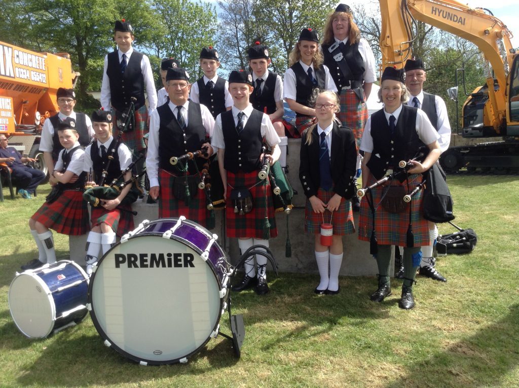 Douglas with members of the Cupar Pipe Band