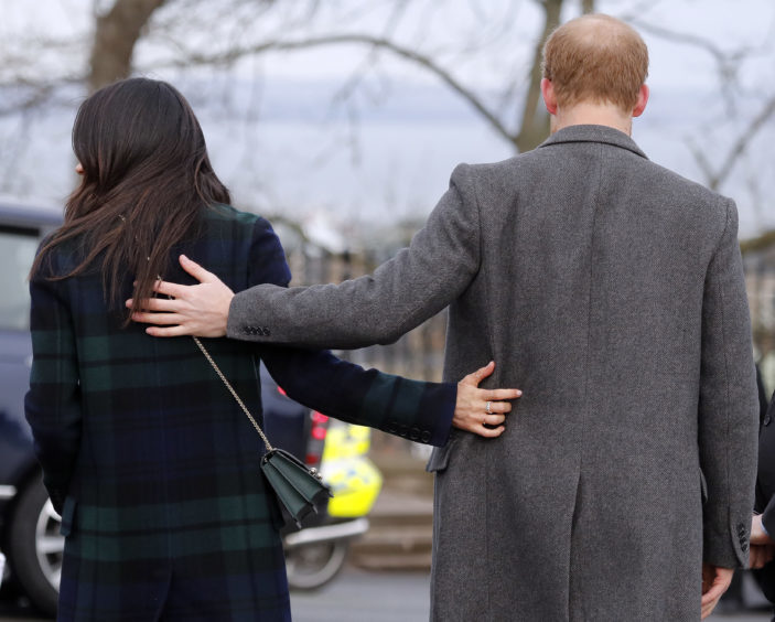 Britain's Prince Harry and his fiancee Meghan Markle arrive at Edinburgh Castle