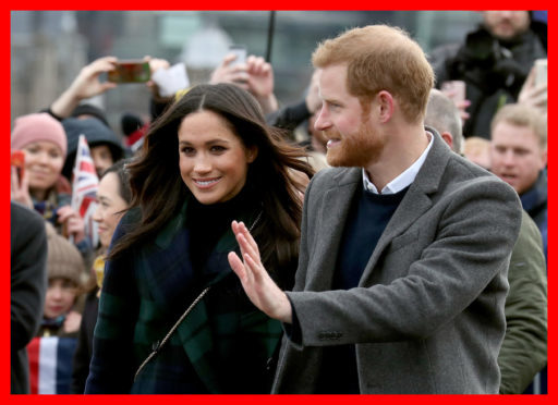 Prince Harry and Meghan Markle during a walkabout on the esplanade at Edinburgh Castle.