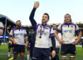 Man of the match Greig Laidlaw takes the applause of the Murrayfield crowd at full time