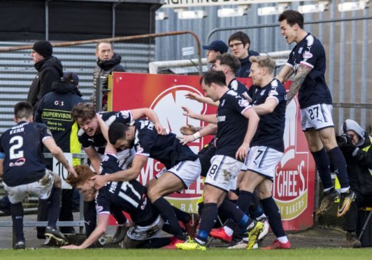 Everyone joins in to congratulate scorer Simon Murray.