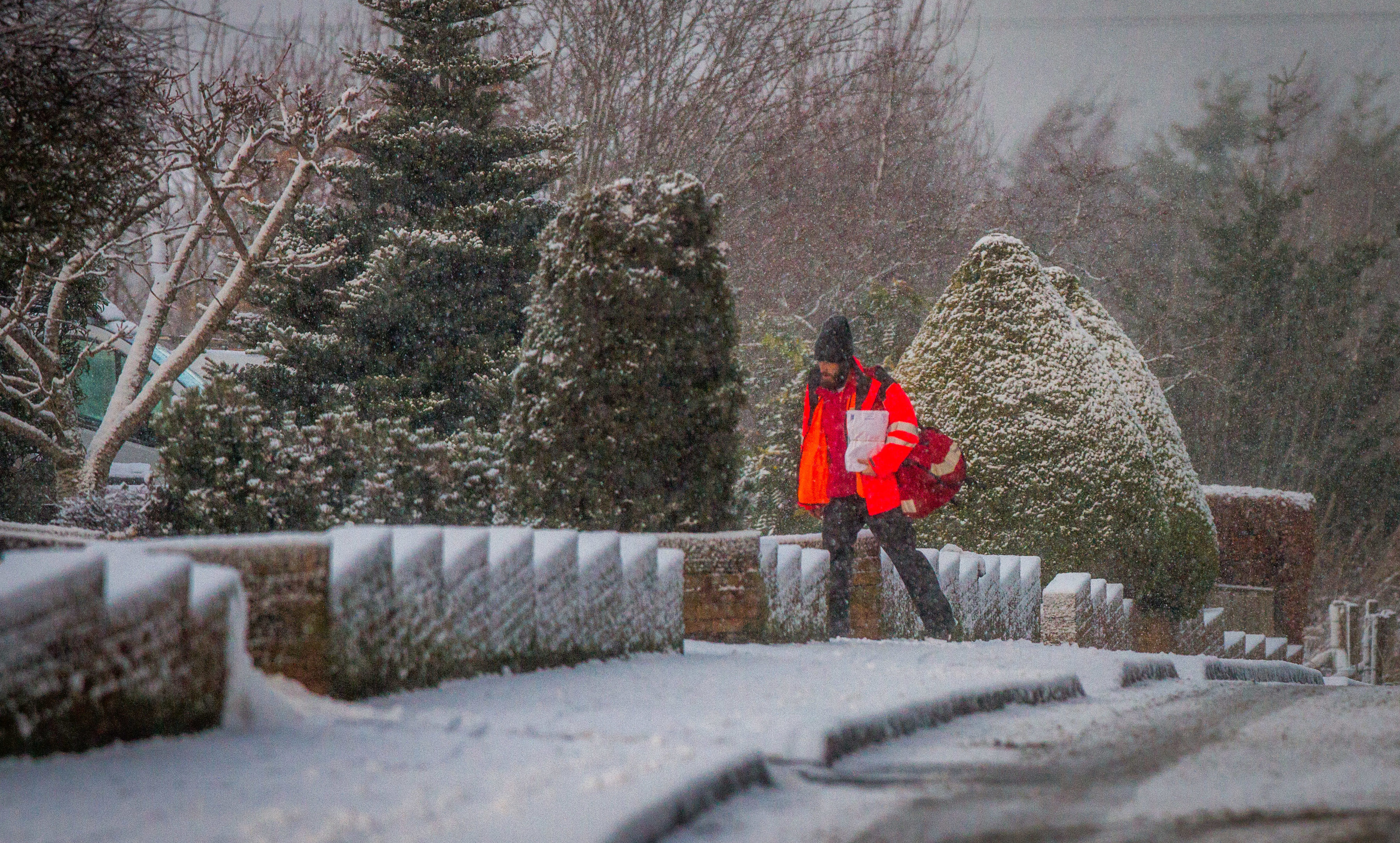 A postman braves the recent cold snap in  Castleton Road, Auchterarder.