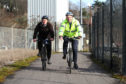 Councillor Kevin Cordell with sustainable transport team leader John Berry on a cycle route.  He has championed green travel in and around Dundee.