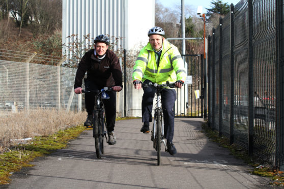 Councillor Kevin Cordell with sustainable transport team leader John Berry on a cycle route.  He has championed green travel in and around Dundee.