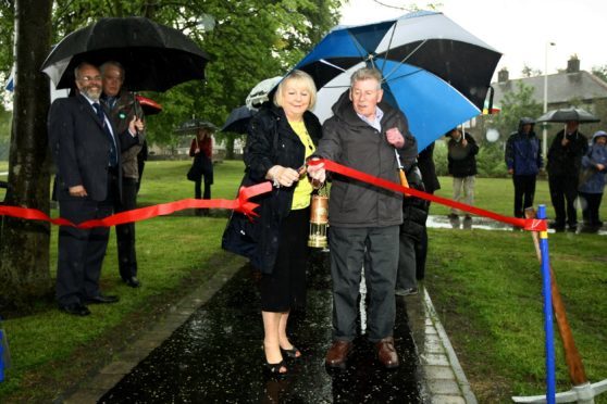 Councillor Helen Law and Joe Miller, the old plugline driver opens the first phase of the garden in 2014