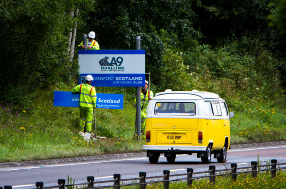 Signs for the A9 dualling project being put up north of Perth.