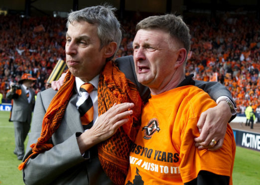 The late Derek Robertson, celebrating Dundee United's Scottish Cup final win in 2010 with club legend Paul Heggarty.