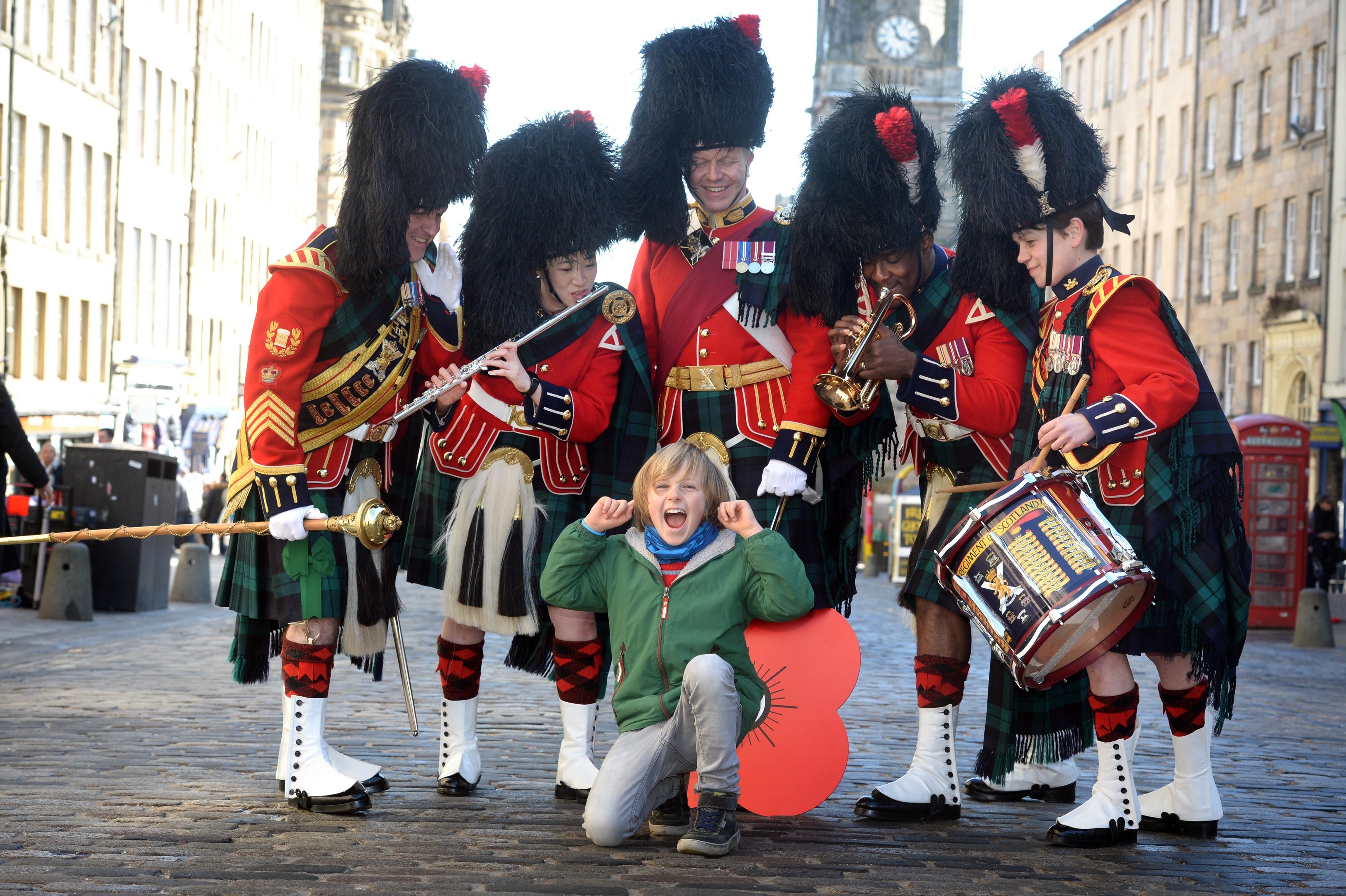 The Band of The Royal Regiment of Scotland was joined by young German tourist Julius Hagedorn, eight, who is over in Edinburgh on holiday with his family.