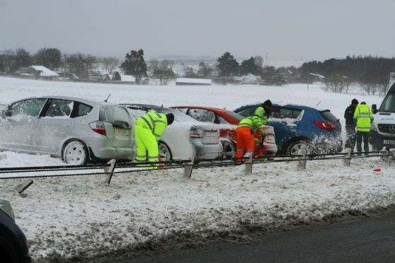 Clearing up after a four-car accident on the A90 on Angus on Friday morning.