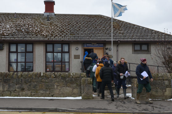 Searchers at the Madras Rugby Club pavilion.