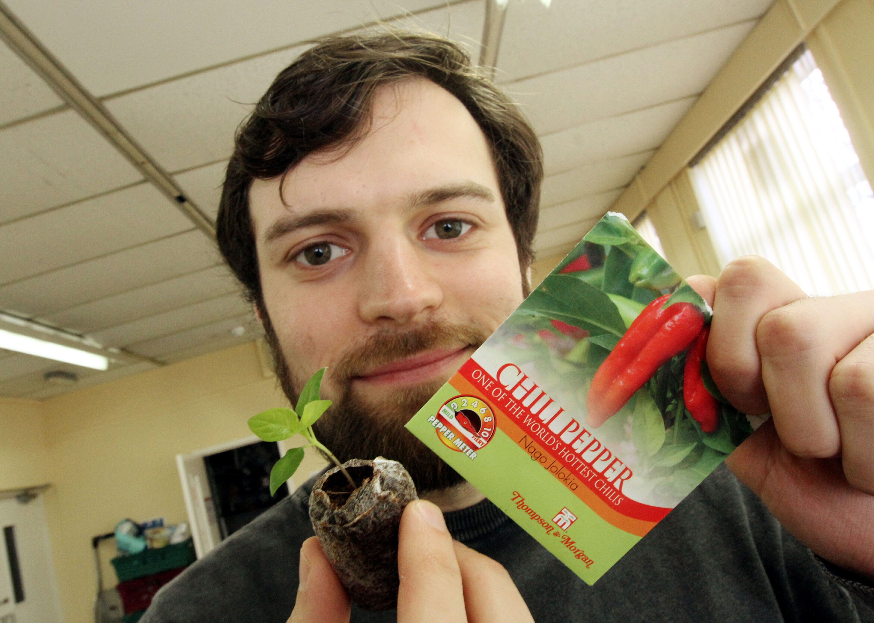 Isa with one of his newly planted ghost peppers