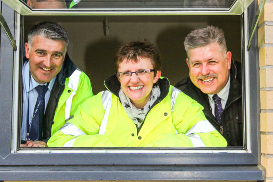 Committee convener Judy Hamilton (centre) has warmly welcomed the cash for housing across Fife.