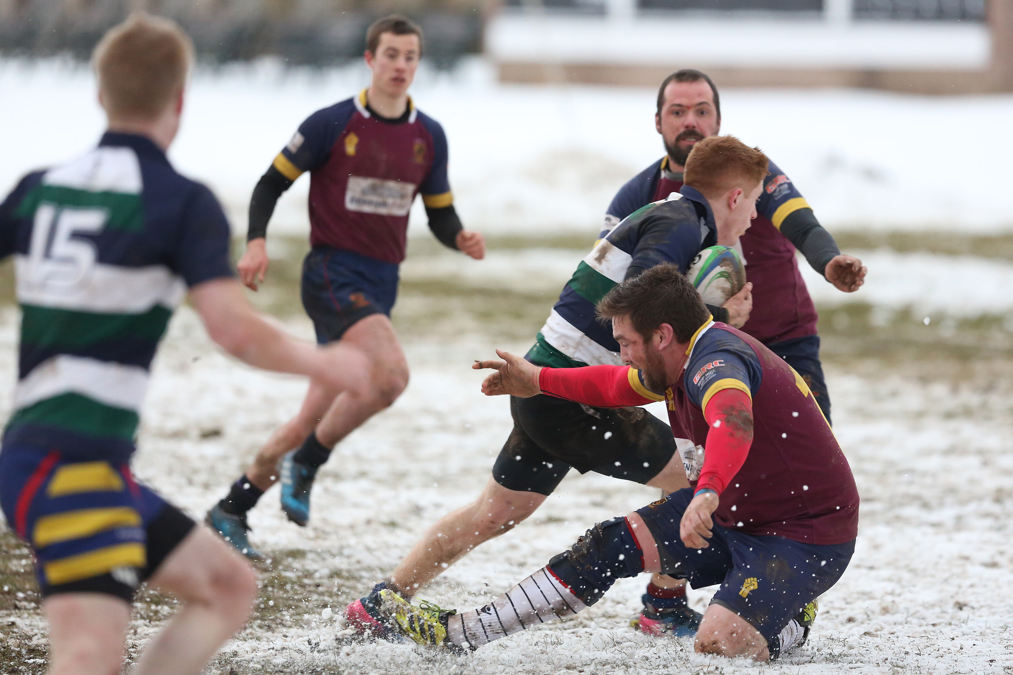 Medics' Michael Finnerty goes through the snow and the Panmure defence during Saturday's BT Midlands Bowl Final at Forthill.