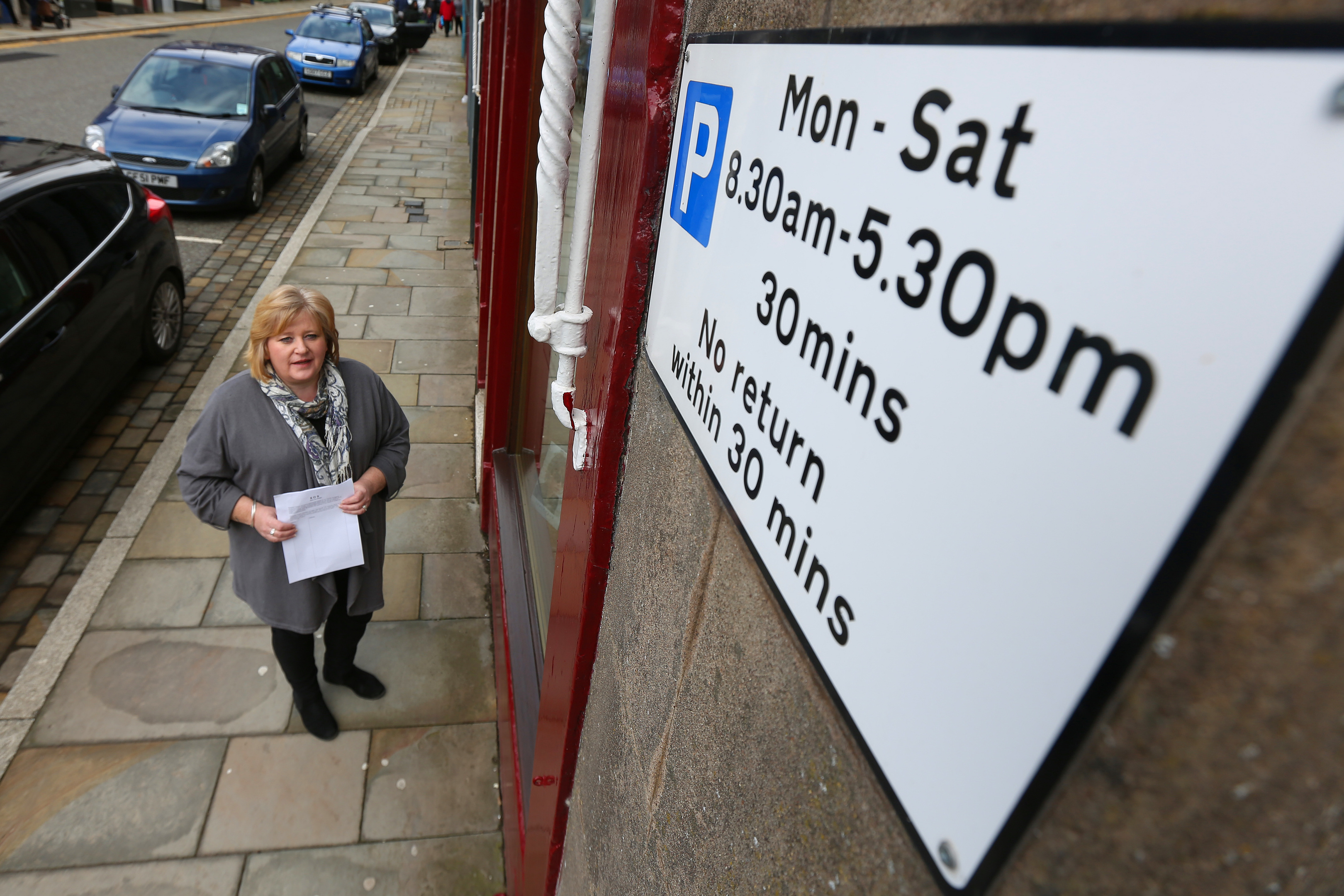 Jill Scott in Brechin High Street, with her petition against proposed parking charges.