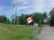 Flags at full flutter on the road from Shediac to Miramichi.