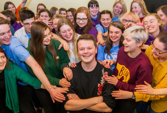 Neil Lavin, a fourth year student at Duncan of Jordanstone College of Art and Design who is also director of Dundee University Amateur Operatic Society. Picture shows Neil Lavin (Director) in the centre surrounded by members