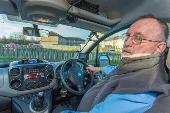 John Aitchison of A1tch Taxis showing the CCTV camera system used in their vehicles.