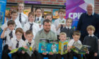 Danny Griffin of St Johnstone joined Atholl Henderson (Chief Executive Saints Community Trust) and Jill MacKintosh (P&K Library Services Co ordinator) and local schoolchildren to help launch the Saints new 4-4-2 reading initiative at the North Inch Community Campus