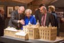 Mary, Dowager Countess of Strathmore inspeting the Streatlam Castle model with (left) Jonathan Peacock (Bowes Museum of Co. Durham) and (right) Martin Saville (builder of the model).