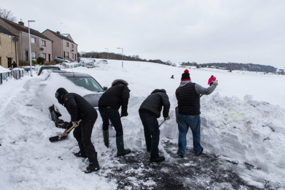 Cardenden residents Rab Wilson, Brian Allen, Brian Donaldson, Kevin Diamond and Michael Russell start to unearth their vehicles buried under the drifts.