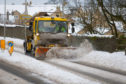 A snow plough makes its way up towards Leslie from Glenrothes.