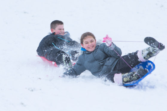 Children having great fun sledging at Riverside Park in Glenrothes after their school was closed by the snow.