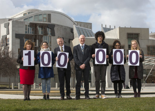 Politicians and V and A representatives outside the Scottish Parliament on Wednesday
