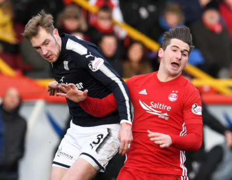 Aberdeen's Kenny McLean battles with Kevin Holt.