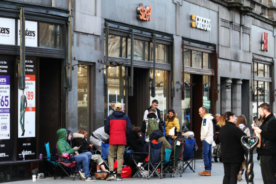 A queue of people on camping chairs is building outside Size? for a new pair of trainers which go on sale tomorrow.